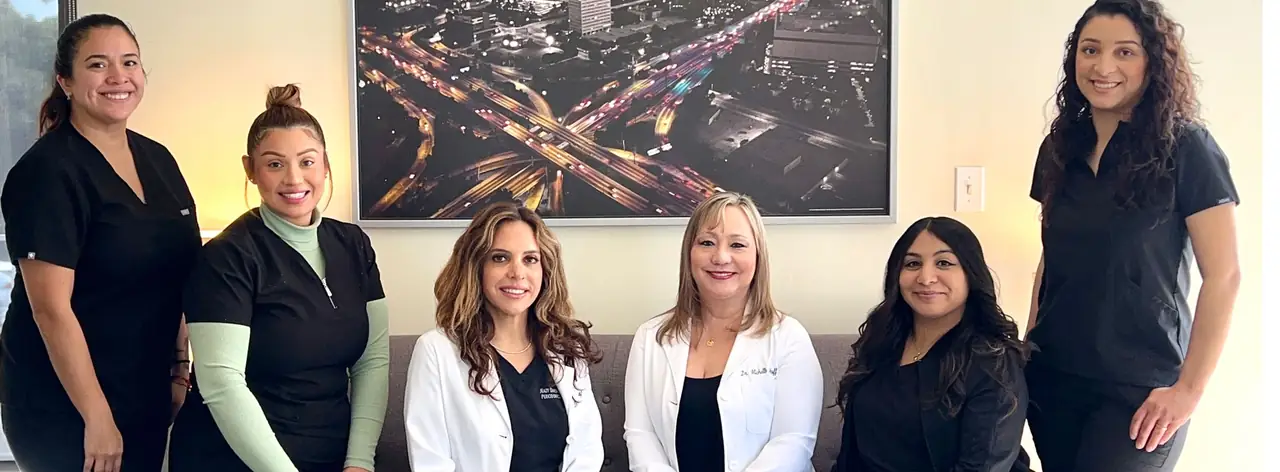 The Bixby Knolls Dental Group team in the practice's lobby at 3903 Long Beach Blvd., Long Beach.